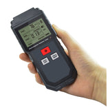 A person holding the Handheld Digital EMF Meter, displaying a reading on its LCD screen.