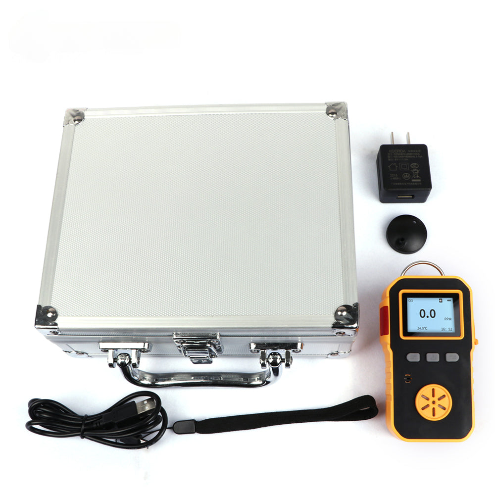 The complete kit including the CO detector, charging cable, adapter, and aluminum carrying case.