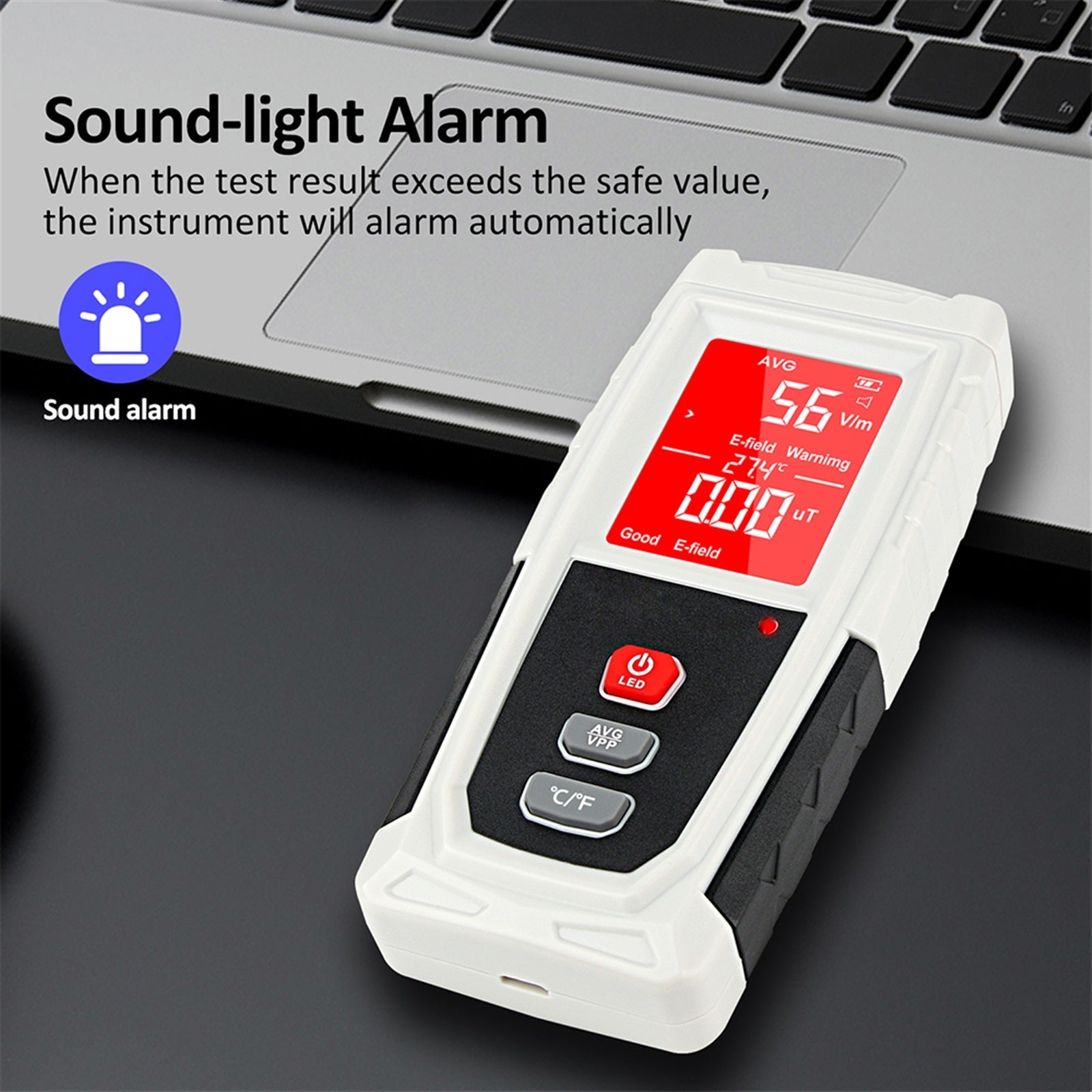 Close-up of the EMF meter's screen showing electric field and magnetic field readings with units.