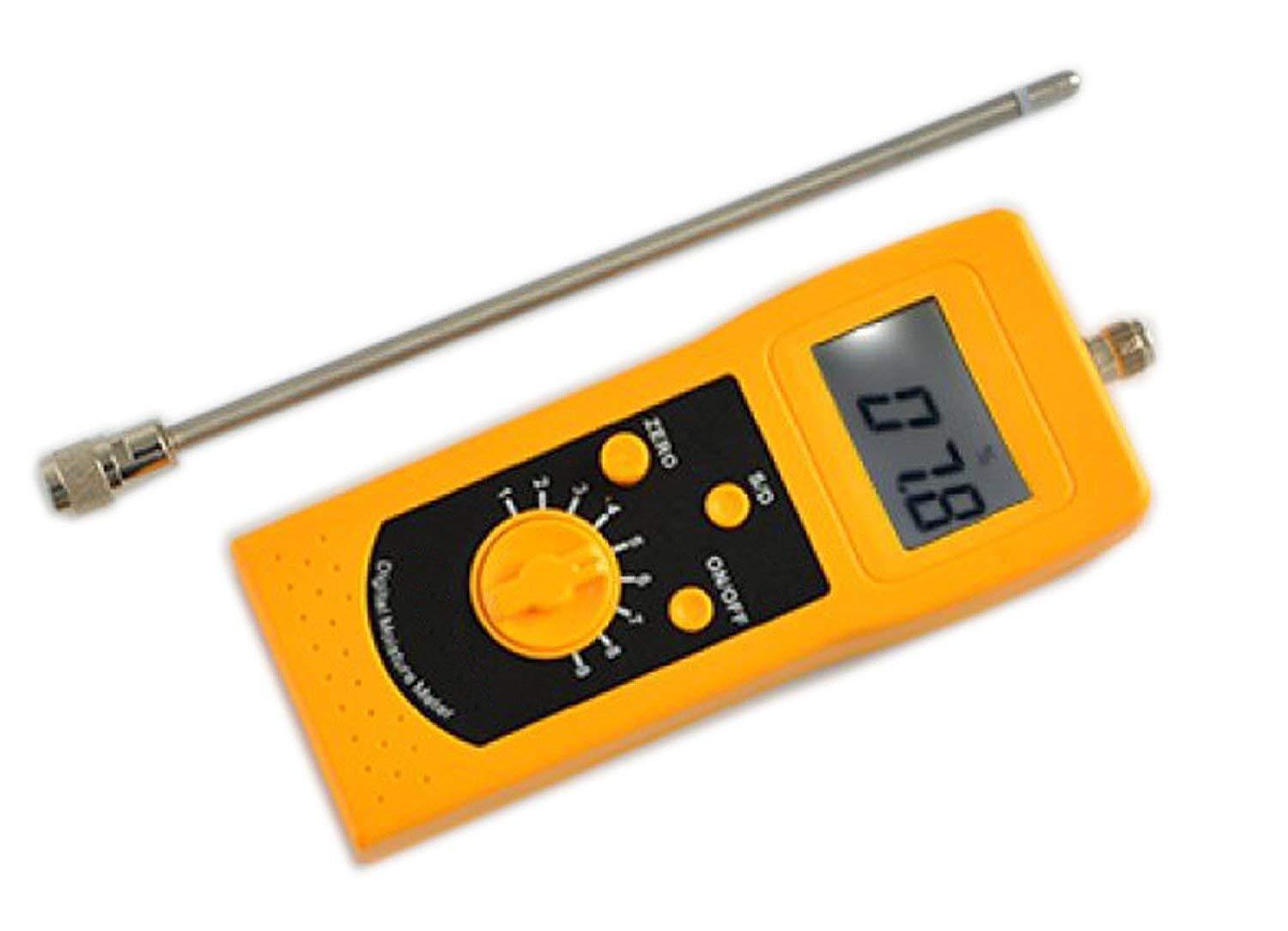 The DM300C high-frequency moisture meter shown with its probe extended and the digital display lit.