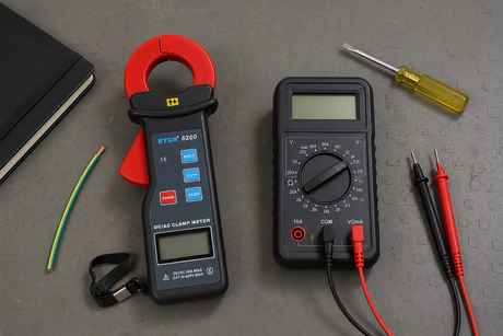 Clamp meter and digital multimeter compared on an electrical workbench