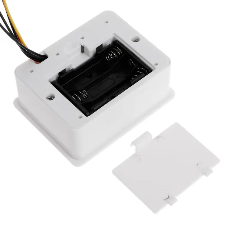 Rear view of the digital flow meter showing the battery compartment for 3x AA batteries.