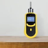 Front view of a yellow pump gas detector with display, controls and straight metal inlet